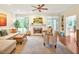 Bright living room with a fireplace, plush seating, large windows, and stylish decor at 14 Marigold Pl, Durham, NC 27705