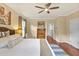 Serene main bedroom featuring a king-size bed, soft lighting, and access to a closet at 14 Marigold Pl, Durham, NC 27705