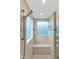 Modern tiled shower with bench seating, rainfall shower head, and decorative glass accents at 14 Marigold Pl, Durham, NC 27705