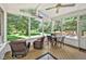 Sunroom provides a beautiful transition to outdoor living and features wood flooring at 14 Marigold Pl, Durham, NC 27705