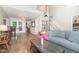 Open-concept living space with hardwood floors, stairs, and a view into the kitchen at 1426 Cedar Branch Ct, Wake Forest, NC 27587
