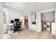 Bright home office featuring a desk, shelving, natural light, and a cozy reading nook at 1426 Cedar Branch Ct, Wake Forest, NC 27587