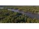Aerial view of the lake surrounded by trees at 144 Shawnee Dr, Louisburg, NC 27549