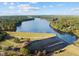Aerial view of the lake and dam in the community at 144 Shawnee Dr, Louisburg, NC 27549