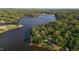 Breathtaking aerial view of a waterfront property with lush greenery and access to a serene lake at 144 Shawnee Dr, Louisburg, NC 27549