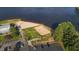 Aerial view of the beach and lake featuring a sand volleyball court at 144 Shawnee Dr, Louisburg, NC 27549