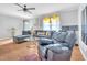 Comfortable living room with hardwood floors, a ceiling fan, and plenty of seating at 144 Shawnee Dr, Louisburg, NC 27549