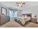 Bright main bedroom with a king-size bed, dresser, and soothing gray walls at 144 Shawnee Dr, Louisburg, NC 27549