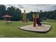 This playground features slides, swings, and a rocketship for children to play at 144 Shawnee Dr, Louisburg, NC 27549