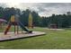 Community playground with slides and a rocket climbing structure at 144 Shawnee Dr, Louisburg, NC 27549