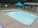 Community Pool with a concrete surround and blue vinyl lining at 144 Shawnee Dr, Louisburg, NC 27549