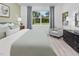 Serene bedroom with natural light, complemented by soothing wall colors and a cozy armchair at 148 Vaughan Farms Drive Dr, Angier, NC 27501
