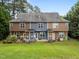 Townhome backyard with small patio and well-maintained lawn, perfect for outdoor relaxation at 158 Pineland Cir, Raleigh, NC 27606