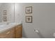 This bathroom features a single vanity, framed art, and a large mirror at 158 Pineland Cir, Raleigh, NC 27606