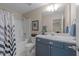 This bathroom features a shower/tub combo, single vanity, and neutral paint at 158 Pineland Cir, Raleigh, NC 27606