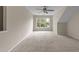 Large bedroom with neutral carpet, a ceiling fan, and a bright window overlooking the landscape at 158 Pineland Cir, Raleigh, NC 27606