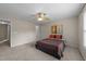 This bedroom features a ceiling fan, window, and neutral carpeting at 158 Pineland Cir, Raleigh, NC 27606