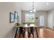 Bright dining area featuring a modern table, chairs, and natural light at 158 Pineland Cir, Raleigh, NC 27606