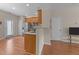 Modern kitchen with stainless steel appliances and breakfast bar seating at 158 Pineland Cir, Raleigh, NC 27606