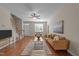 Spacious living room featuring hardwood floors and ample natural light, open floor plan at 158 Pineland Cir, Raleigh, NC 27606