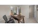 Well-lit office space with a desk, open book, and neutral paint color at 158 Pineland Cir, Raleigh, NC 27606