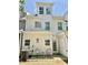 Exterior view of the backyard with a small patio with seating at 166 Gulley Glen Dr, Garner, NC 27529