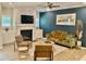 Comfortable living room showcases a fireplace, a sleek television, and stylish decor at 166 Gulley Glen Dr, Garner, NC 27529