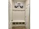 Mudroom with built-in bench and storage, coat hooks, and neutral paint at 166 Gulley Glen Dr, Garner, NC 27529