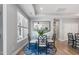 Cozy dining area features a glass top table and a patterned area rug at 1727 Pinecliff Ct, Fuquay Varina, NC 27526