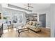 Sunlit living room with stylish decor, fireplace, and an open floor plan at 1727 Pinecliff Ct, Fuquay Varina, NC 27526