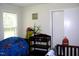 bedroom with themed decor, including a mural and colorful accessories at 1809 S Garnett Ext, Henderson, NC 27536