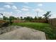 Large fenced backyard with a concrete patio offers privacy and space for relaxation and entertainment at 2001 October Dr, Durham, NC 27703