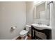 Bathroom featuring wood-look floors, updated vanity and toilet at 2001 October Dr, Durham, NC 27703