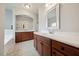Bathroom with dual vanities, large mirrors, and bathtub at 2001 October Dr, Durham, NC 27703