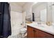 Bathroom featuring a shower-tub combination, wood vanity, and modern fixtures at 2001 October Dr, Durham, NC 27703