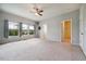 Bright bedroom with carpet, ceiling fan, and windows with natural light at 2001 October Dr, Durham, NC 27703