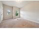 Bedroom featuring neutral walls, carpet, two windows, and great natural light at 2001 October Dr, Durham, NC 27703