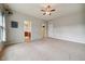 Bedroom featuring carpet, ceiling fan, and doorway to bathroom at 2001 October Dr, Durham, NC 27703