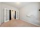 Bedroom with neutral walls, carpet, and decorative white barn-like door trim at 2001 October Dr, Durham, NC 27703