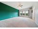 Spacious bedroom with carpet, ceiling fan, and large windows at 2001 October Dr, Durham, NC 27703