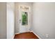 A bright entryway features a white door with glass and hardwood floors at 2001 October Dr, Durham, NC 27703