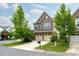Charming two-story home featuring an attached two-car garage and well-maintained landscaping at 2001 October Dr, Durham, NC 27703
