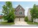 Charming two-story home with a two-car garage and well-maintained lawn at 2001 October Dr, Durham, NC 27703