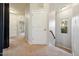 Upstairs hallway with white doors and window at 2001 October Dr, Durham, NC 27703