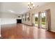 Living area with a fireplace, hardwood floors, and sliding glass doors leading to the backyard at 2001 October Dr, Durham, NC 27703