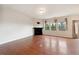 Spacious living room with hardwood floors, fireplace, and lots of natural light at 2001 October Dr, Durham, NC 27703