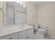 Bathroom featuring neutral walls, white cabinets, tile flooring, and a shower with a curtain at 2014 Muirfield Ct, Elon, NC 27244