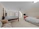 Spacious bedroom featuring three beds, comfortable seating, and neutral tones throughout at 2014 Muirfield Ct, Elon, NC 27244