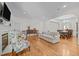 Expansive living room showcasing hardwood floors, a fireplace, and an open floor plan at 2014 Muirfield Ct, Elon, NC 27244