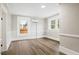 Comfortable bedroom with hardwood flooring, fresh paint, and an efficient mini-split system at 205 Forest Hill Ave, Rocky Mount, NC 27804